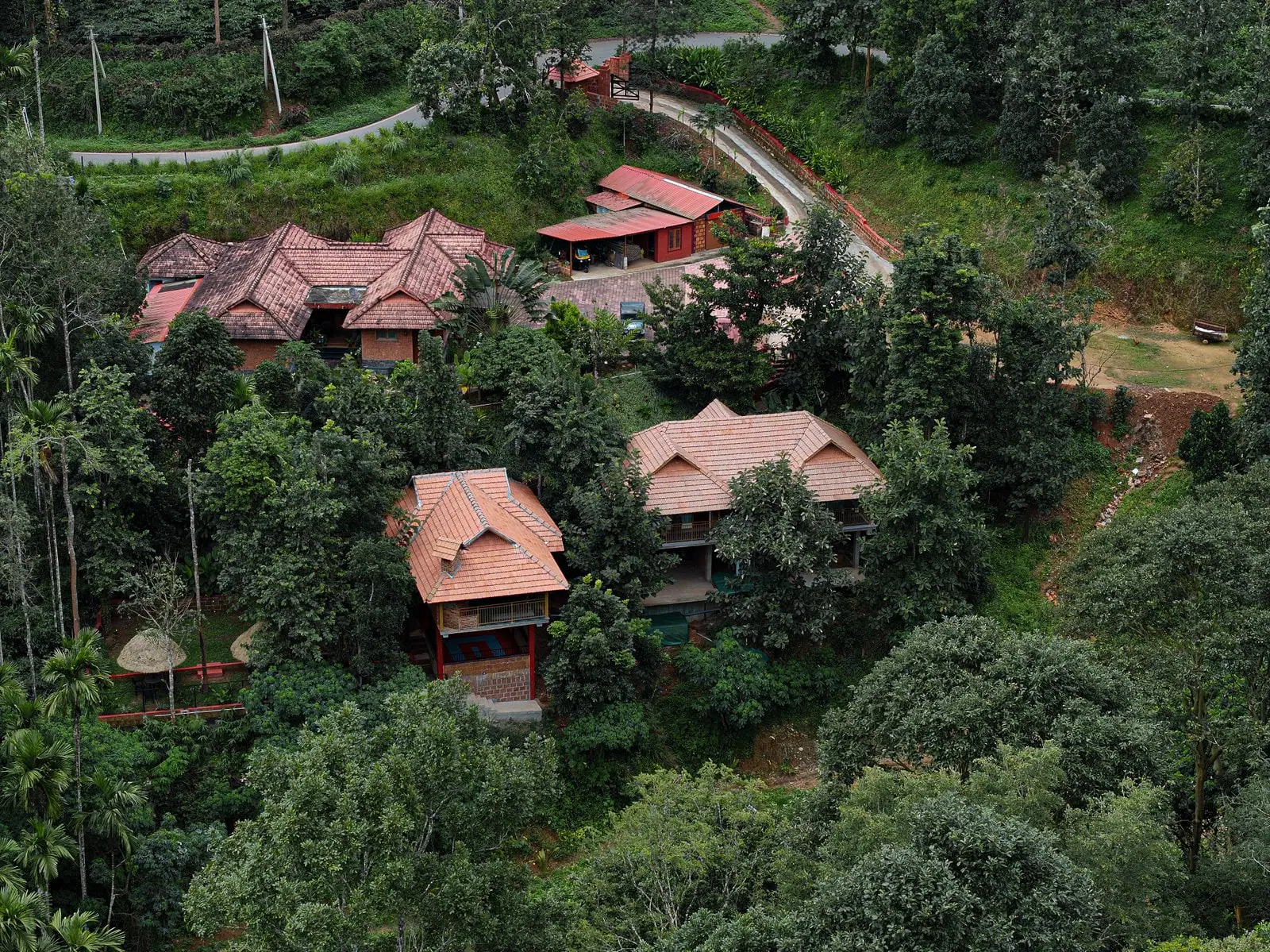 Drone view of the cottages among the estate's trees