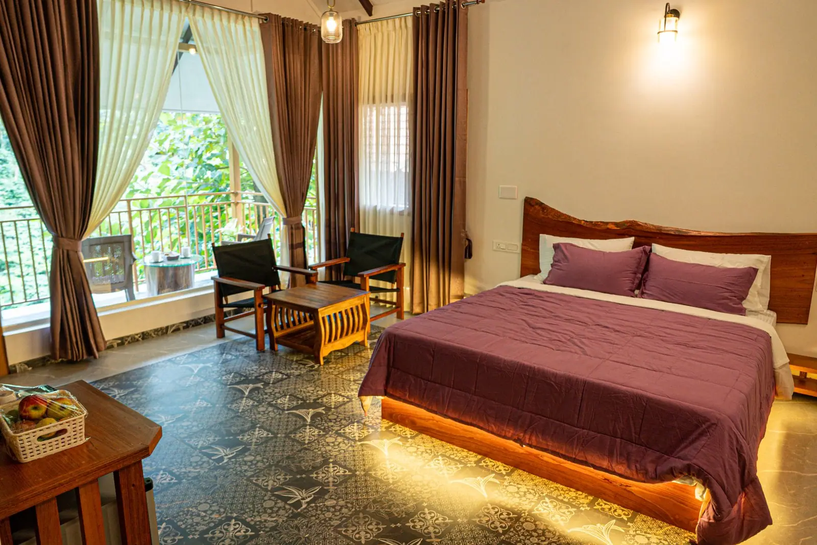 The suite at night, soft light glowing beneath the bed